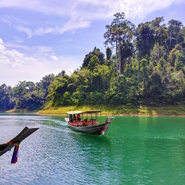 Traditional Long-Tail Boat Exploring Cheow Lan Lake's Emerald Waters - Khao Sok Lake Explorer Safari 2 Days 1 Night