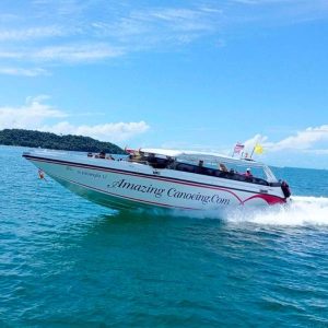 Glide across crystal-clear waters as your premium speedboat slices through the Andaman Sea - Premium Phi Phi Bamboo island tour