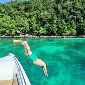Mask on, snorkel ready - swim with tropical fish over vibrant coral reefs in one of Thailand’s most iconic snorkeling spots