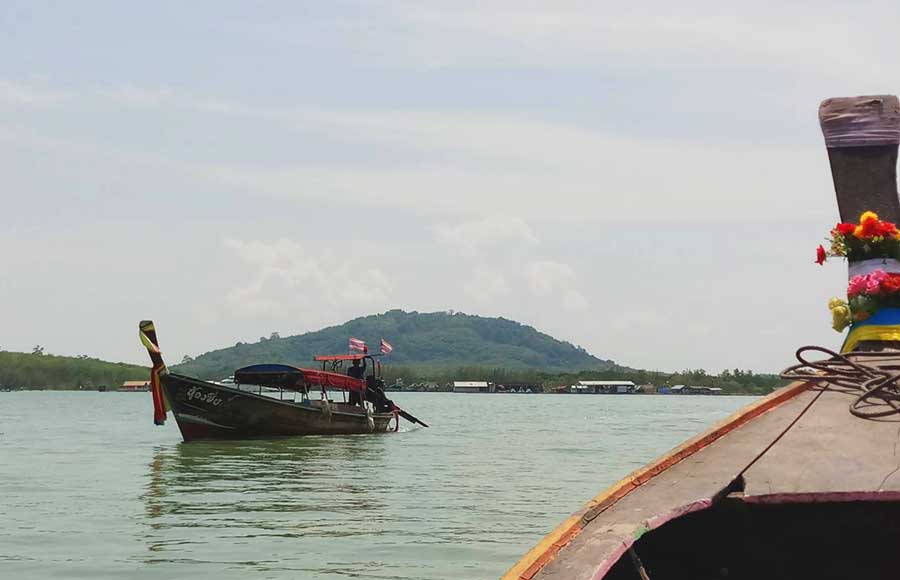 Departing early morning by long tail boat to Rang Yai island