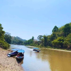 Glide through nature's masterpiece on a long-tail boat ride - Private Chiang Rai Jungle Trekking at its finest